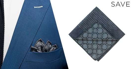 double sided blue suit accessory pocket square on white background and folded into a blue suit jacket